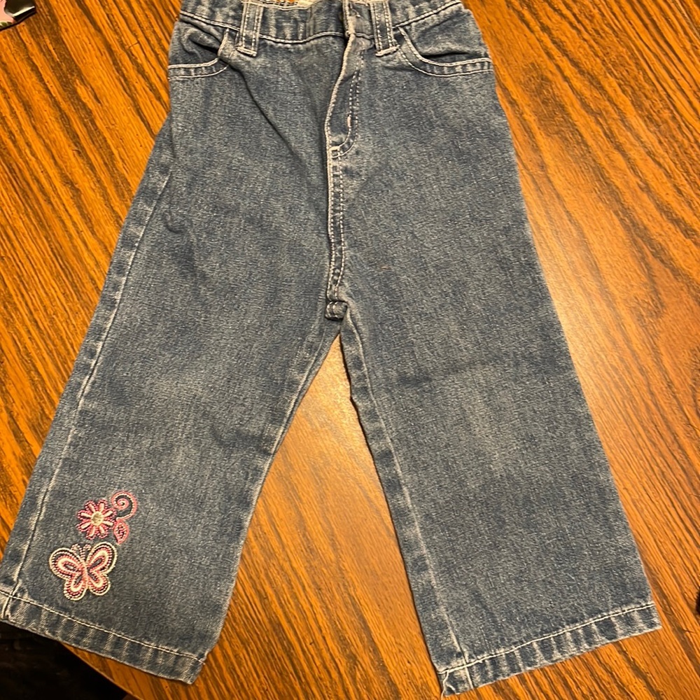 Girls 24 months jeans with butterfly and flower on leg in excellent condition